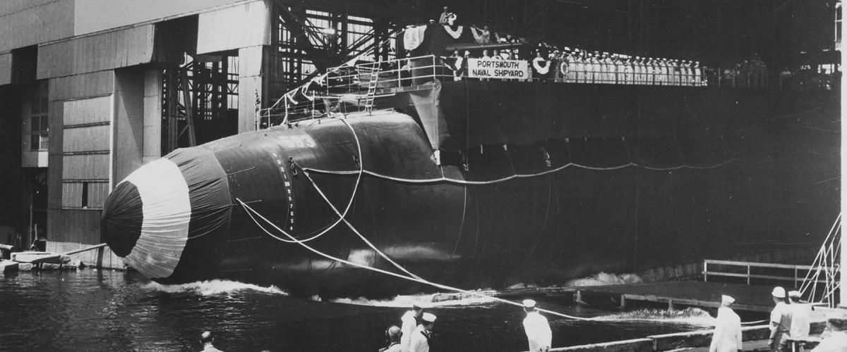 The fully dressed Thresher hits the water during her launching ceremony